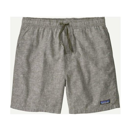 Side view of the Patagonia Men's Baggies Naturals in Feather Grey showing the drawstring waist and small logo patch on the lower right leg.