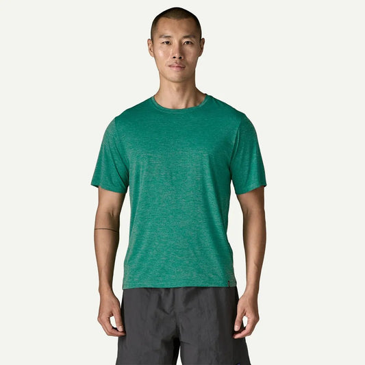 A front view of the Patagonia Men's Cap Cool Daily Shirt in Gem Green - Light Gem Green X-Dye on a model against a white background.