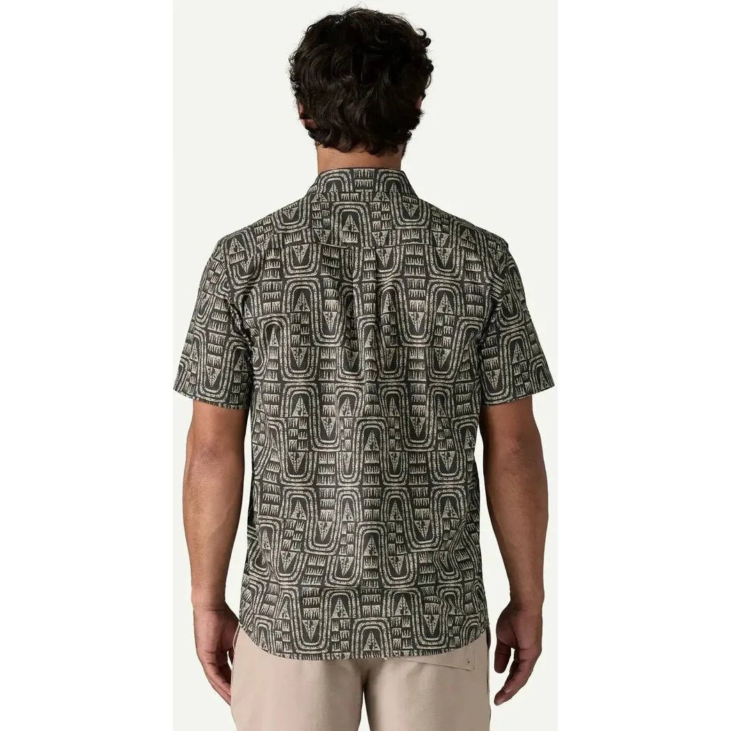 Back view of the Patagonia Men's Go To Shirt in Flow: Sunken Blue on a model wearing light pants against a plain background.