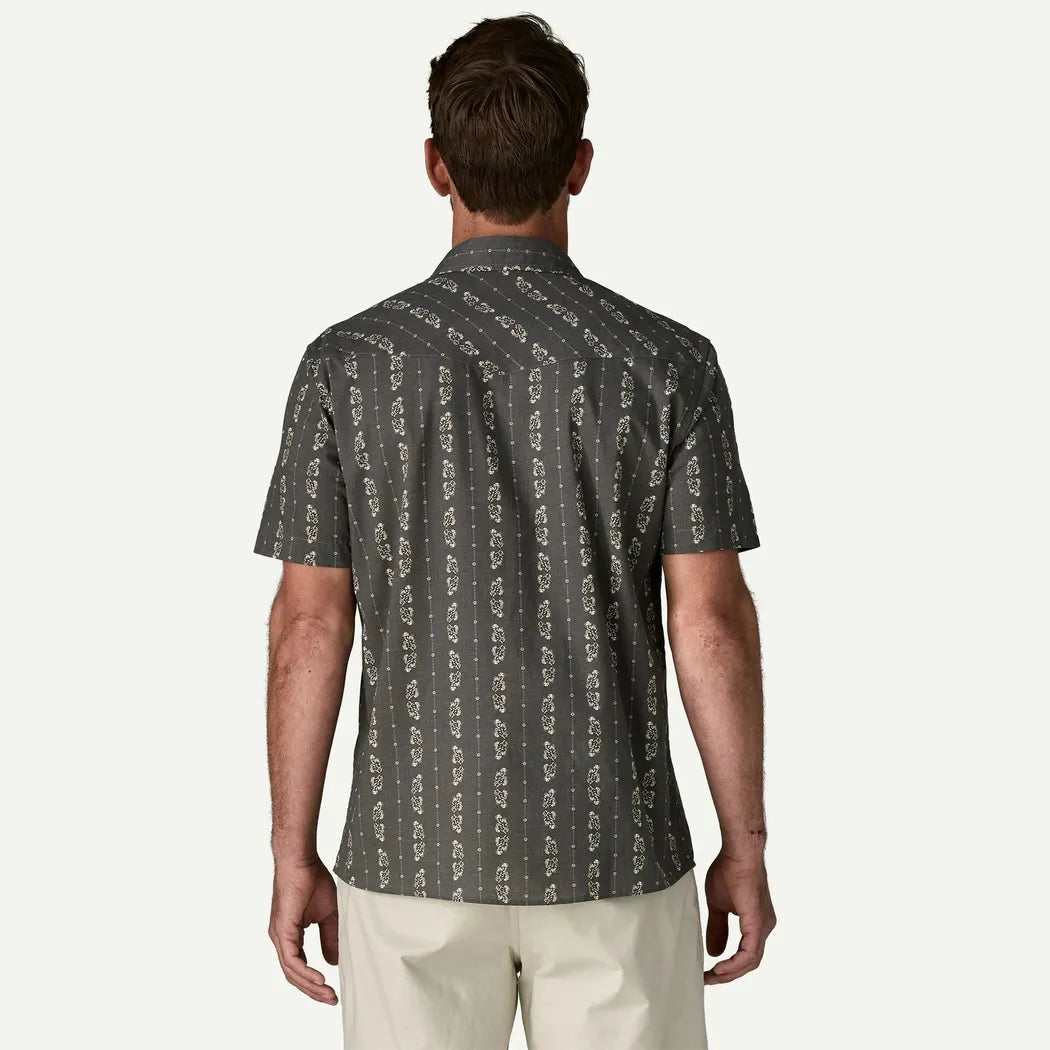 Back view of the Patagonia Men's Go To Western Shirt in Lowlands: Forge Grey on a model wearing light-colored pants against a plain white background.