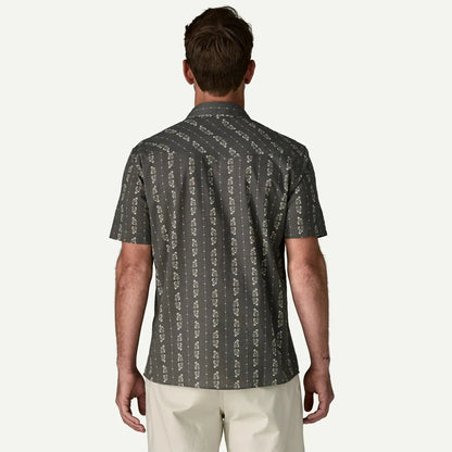 Back view of the Patagonia Men's Go To Western Shirt in Lowlands: Forge Grey on a model wearing light-colored pants against a plain white background.
