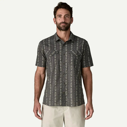 A front view of the Patagonia Men's Go To Western Shirt in Lowlands: Forge Grey on a model wearing light khaki pants against a plain white background.