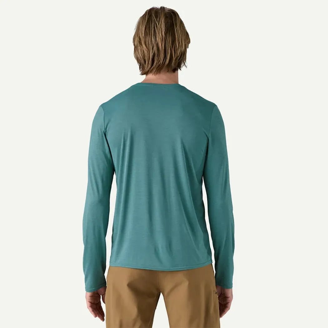 Back view of the Patagonia Men's Long Sleeve Cap Cool Daily Shirt in Wetland Blue, showing a model wearing it against a plain white background.