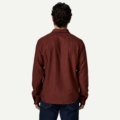 Back view of the Patagonia Men's Long Sleeve Cotton in Conversion LW Fjord Flannel Shirt in Mirror Weave Rusty Red against a white background.