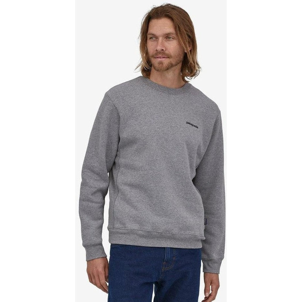 A front view of the Patagonia Men's P-6 Logo Uprisal Crew Sweatshirt in New Navy on a model against a white background.