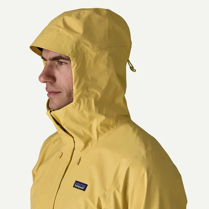 Side view of the Patagonia Men's Torrentshell 3L Jacket in Black with hood up against a white background.