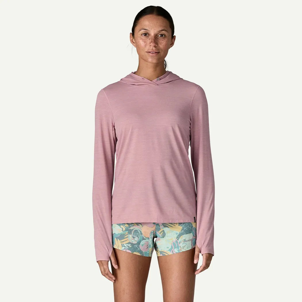 A front view of the Patagonia Women's Cap Cool Ultra Hoody in Light Violet - Quiet Violet X - Dye on a model against a white background.