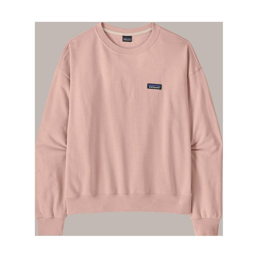 A front view of the Patagonia Women's Daily Crew in Pink Frost with a small logo patch on the chest and a light gray background.