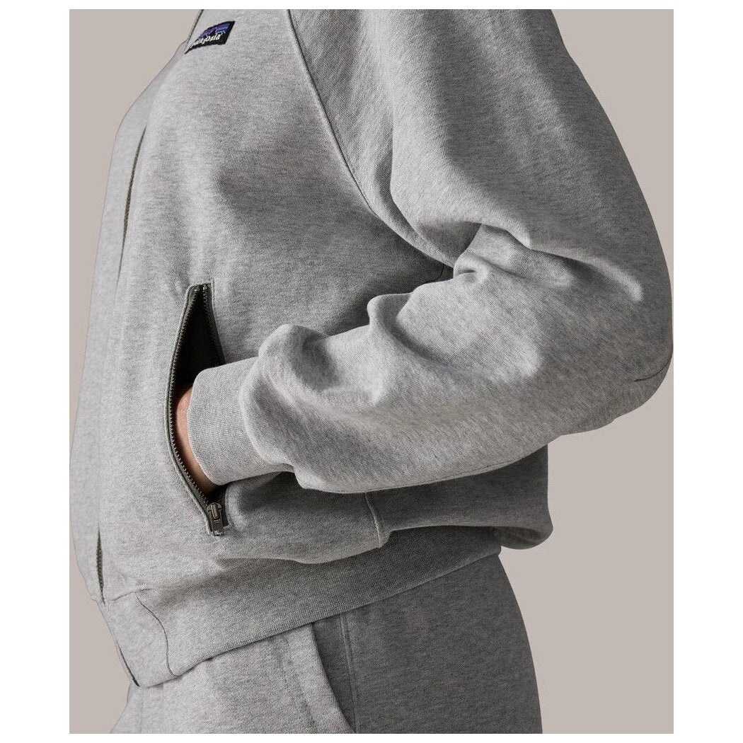 A close-up of the Patagonia Women's Daily Jacket in Berm Brown showing the zippered pocket and soft fabric texture against a neutral background.