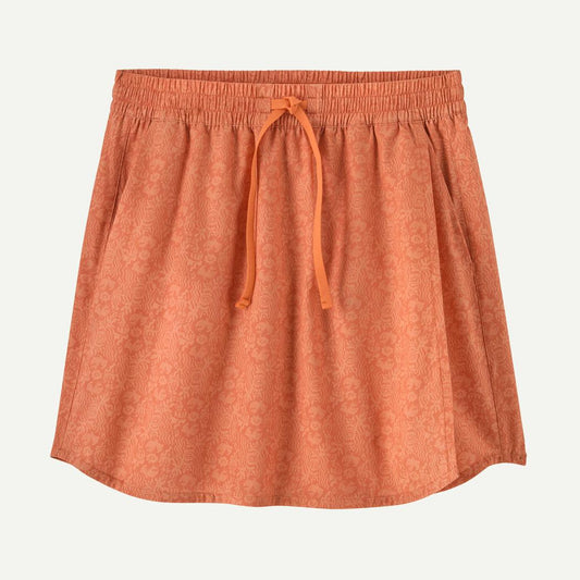 A front view of the Patagonia Women's Fleetwith Skort in Mountain Breeze: Rock Melon with an orange drawstring against a white background.
