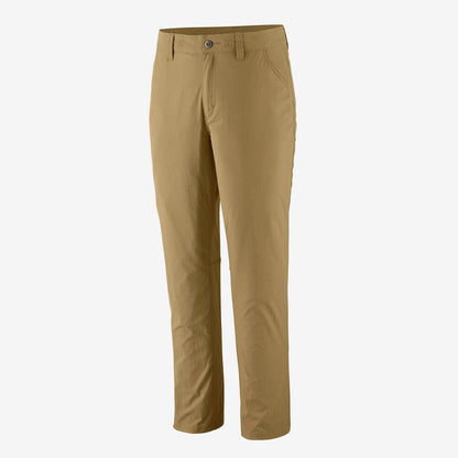 Side view of the Patagonia Women's Quandary Pants in Classic Tan showing the front pocket and button closure against a plain white background.