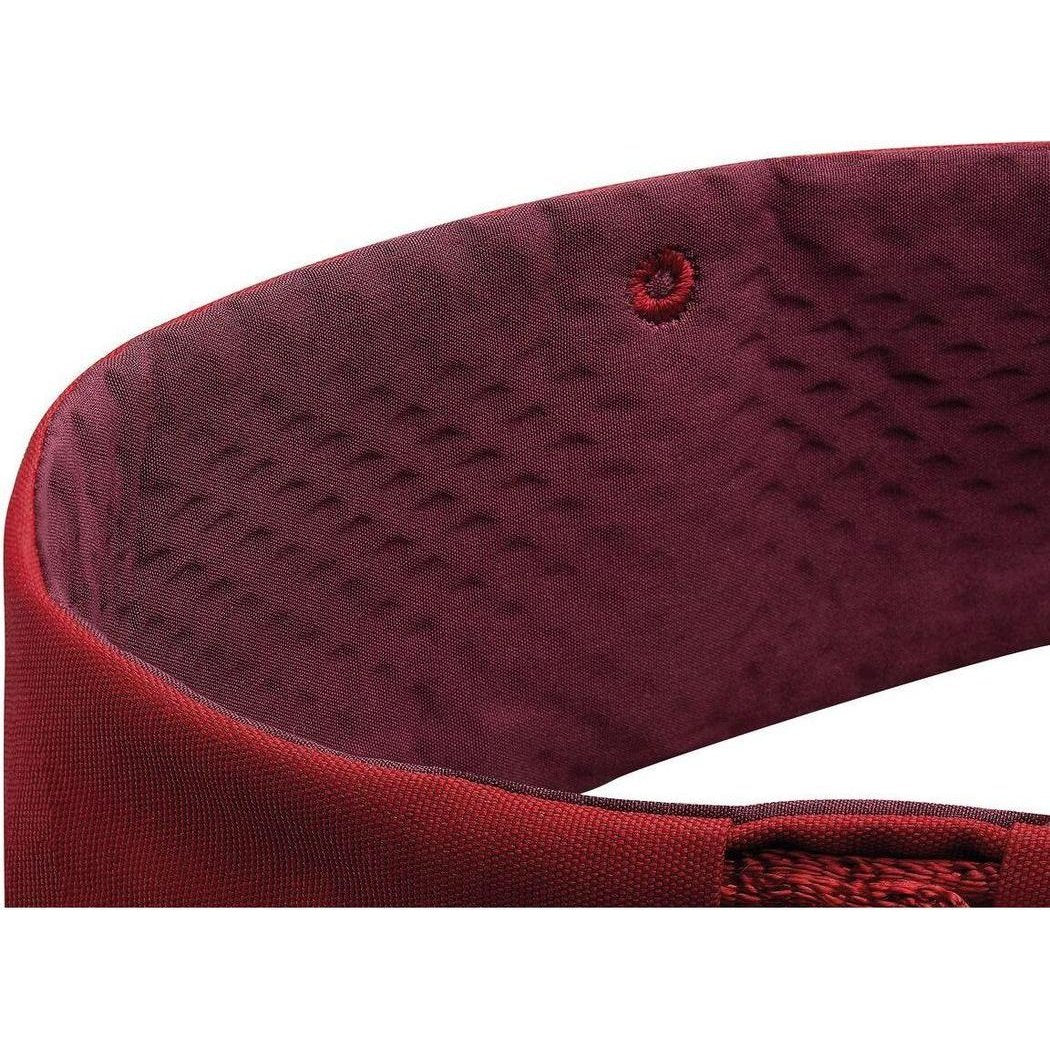The Petzl Adjama dark red climbing harness close-up shows the padded interior and stitching against a white background.
