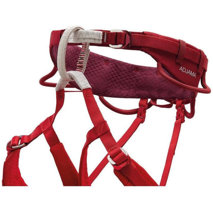 A front view of the Petzl Adjama dark red climbing harness with padded back panel and adjustable straps against a white background.