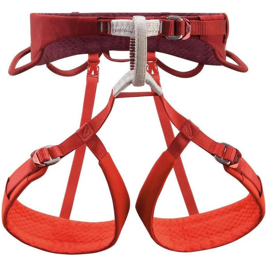 A front view of the Petzl Adjama dark red climbing harness with padded leg loops and a white central adjustment buckle against a white background.