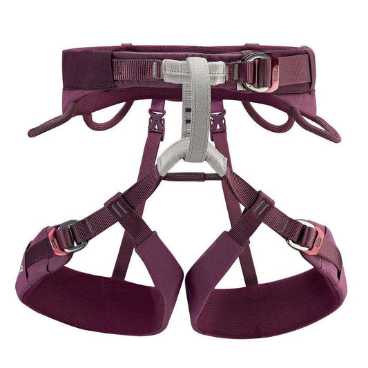 A front view of the Petzl Luna women's climbing harness in Violet showing the waist belt, leg loops, and metal buckles against a white background.