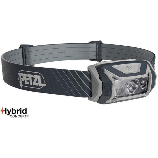 A front view of the Petzl Tikka Core grey headlamp with the brand name visible on the strap, set against a white background.