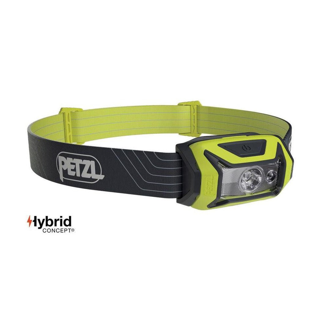 A front view of the Petzl Tikka headlamp with a blue and black design on a white background.