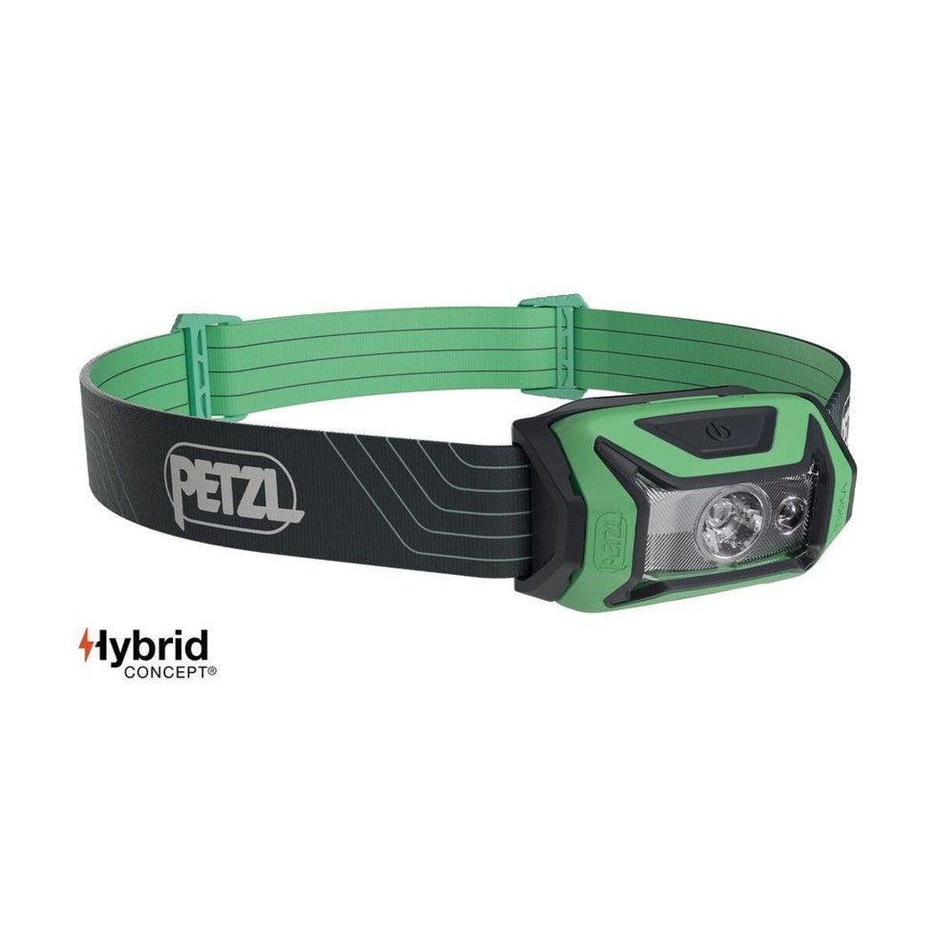 A front view of the Petzl Tikka headlamp in blue with a black strap and green accents, showing the light head and brand logo against a white background.