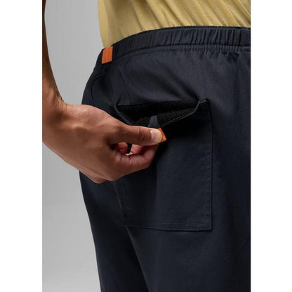 A close-up of a man wearing the Prana Men's Stretch Zion Pull On Short 7" in Nautical, showing the back pocket and elastic waistband against a neutral background.