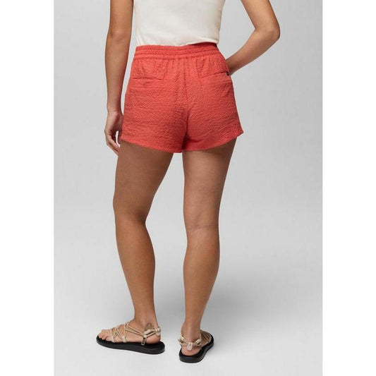 Back view of the Prana Sample - Women's Coastal Sol Short in Lychee on a model wearing sandals against a plain background.