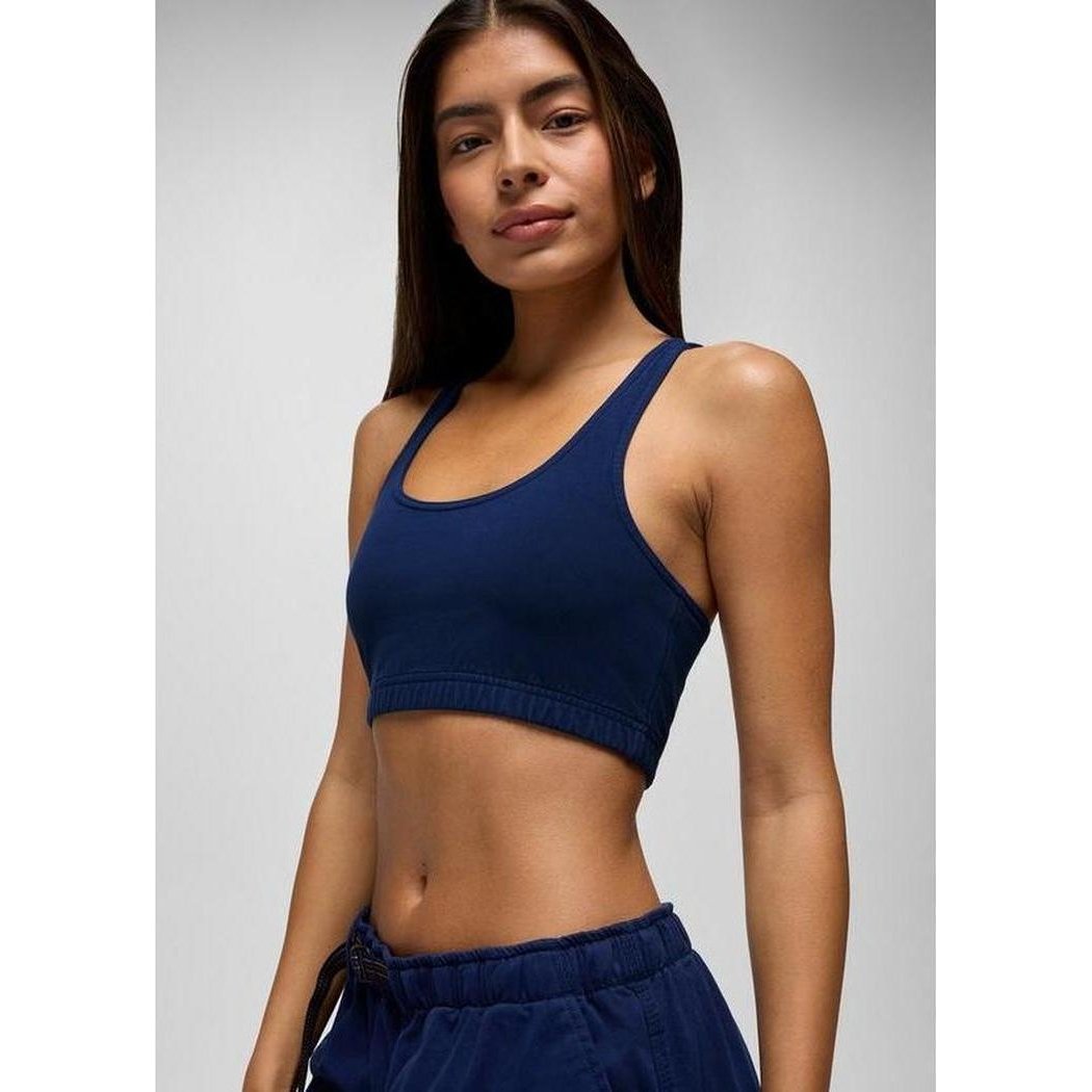 A front view of the Prana Sample - Women's Tornado Bra in Capulet Blue on a model with a light gray background.