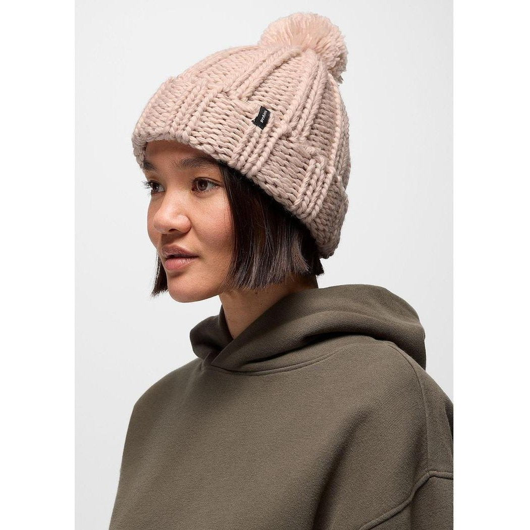 Side view of the Prana Snow Crystal Beanie in Deep Vino on a model wearing a hoodie against a plain background.