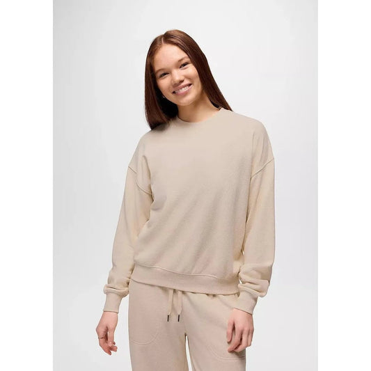 A model wears the Prana Women's Cozy Up Crew Sweatshirt in Canvas Heather against a plain white background.
