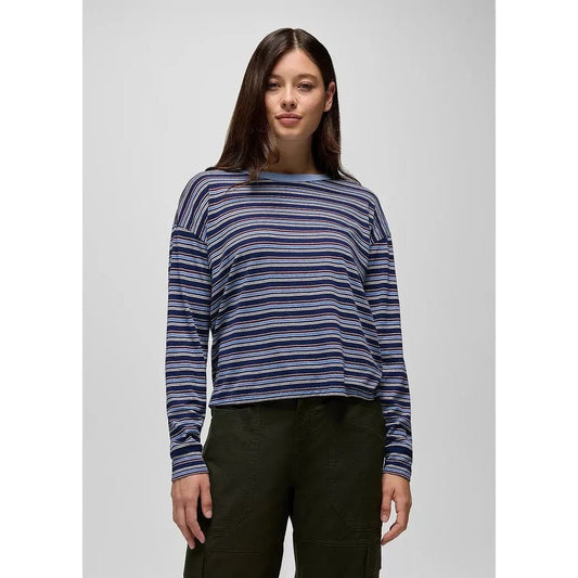 A model wearing the Prana Women's Cozy Up Long Sleeve Crew in Capulet Blue Stripe stands against a plain light background.