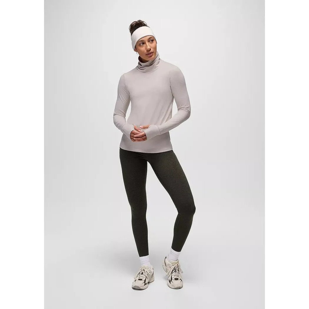 A model wearing the Prana Women's Ice Flow Long Sleeve in Almond Heather stands against a plain white background.