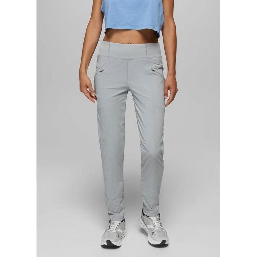 A front view of the Prana Women's Koen Mid Rise Daily Pant in Grey Blue on a model wearing white sneakers against a plain background.