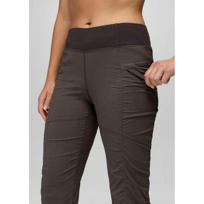 Side view of the Prana Women's Koen Mid Rise Pant in Basalt showing the side pocket against a plain background.
