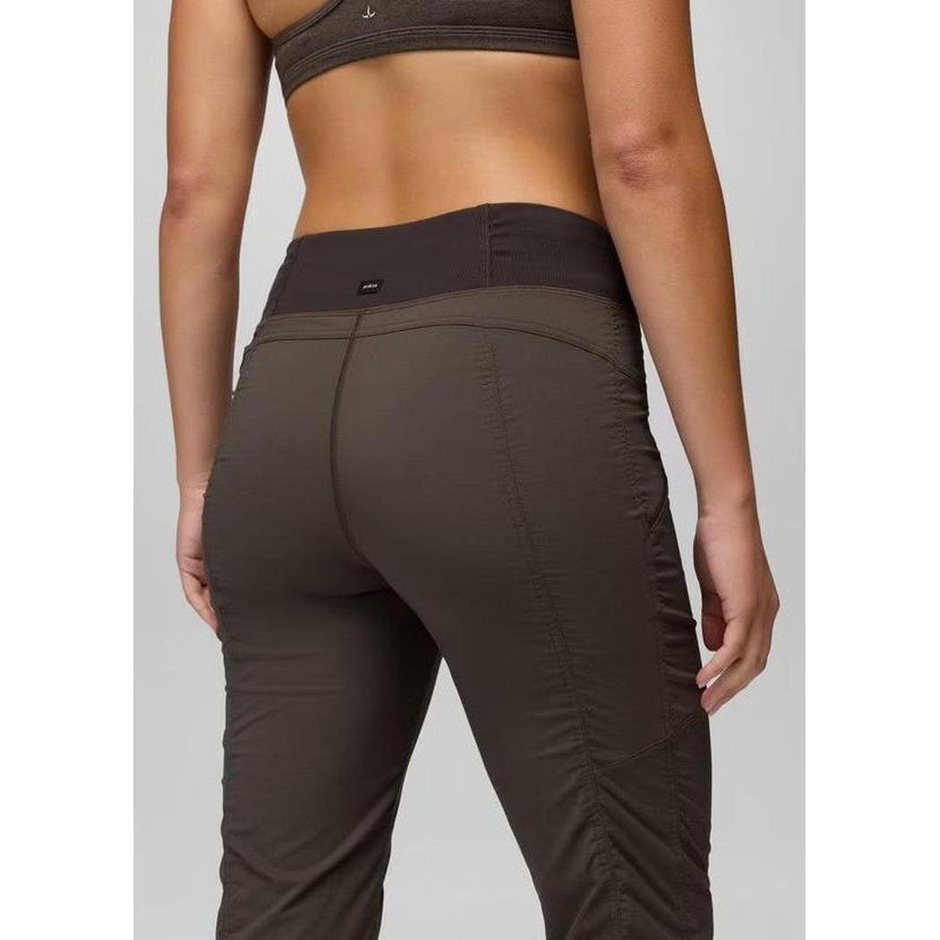 Back view of the Prana Women's Koen Mid Rise Pant in Basalt showing the high waist and ruched detail on the thigh.