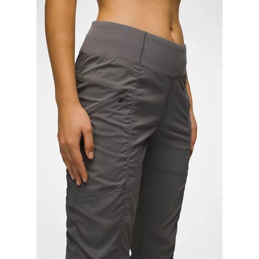 Side view of the Prana Women's Koen Pant in Black showing the zippered pocket and high waistband against a plain background.