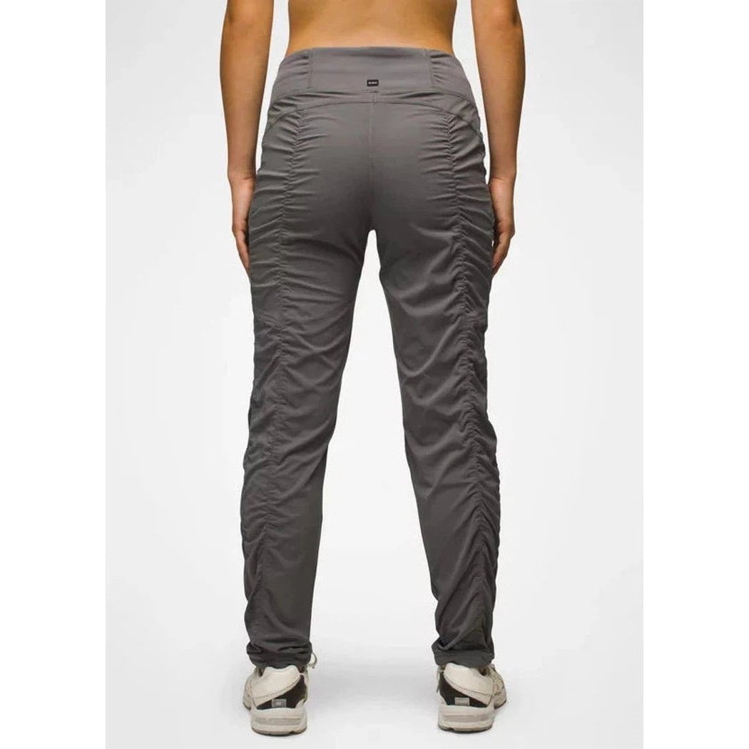Back view of the Prana Women's Koen Pant in Black showing the ruched side panels against a plain white background.