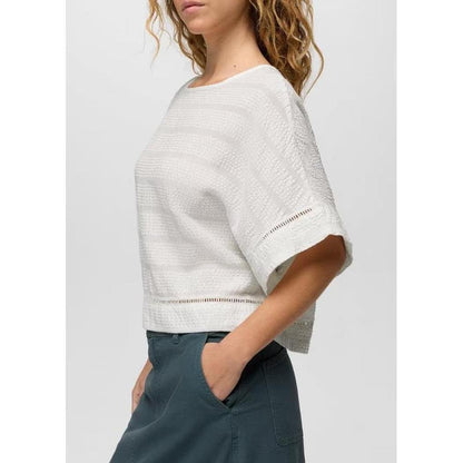 Side view of the Prana Women's Ocean Hills Top in Alba showing the short sleeves and cropped fit against a plain background.