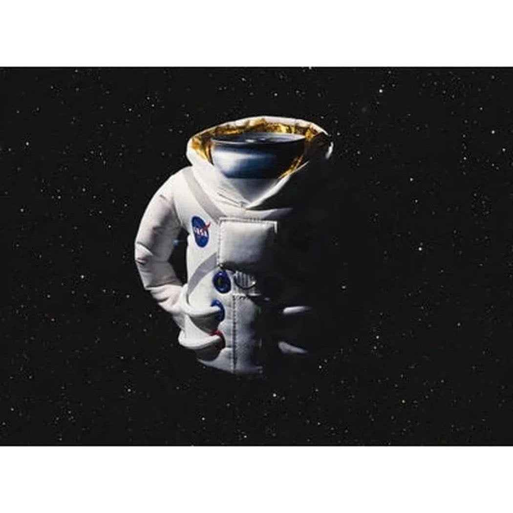 A front view of the Sandy White Puffin Coolers The Space Suit cooler against a starry space background.