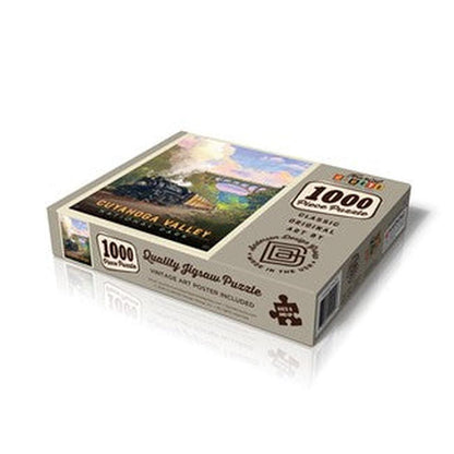 A top-down view of the Pumpernickel Press Cuyahoga Valley Np - Historic Railway 1000-piece puzzle box with a train image on the front.