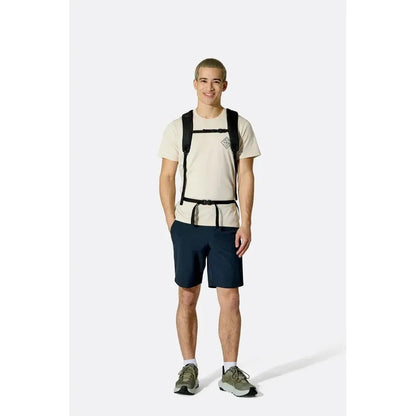 A front view of the Rab Adrift 30 backpack in Black on a model wearing it against a white background.