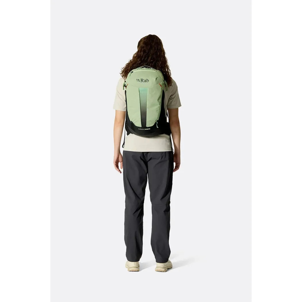 Back view of the Rab Airox 22ND in Fig Green/Black on a model against a plain white background.