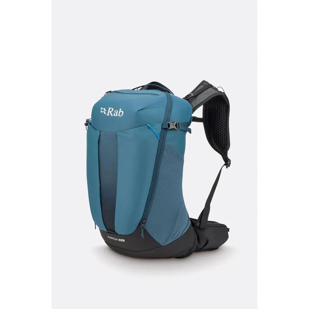 Side view of the Rab Airox 24 backpack in Tempest Blue with a black hip belt and shoulder straps against a white background.