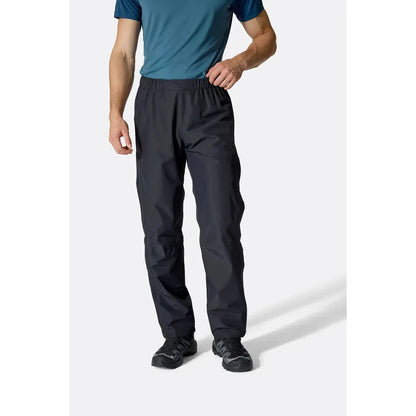 A front view of the Rab Men's Downpour Pants in Black on a model against a white background.