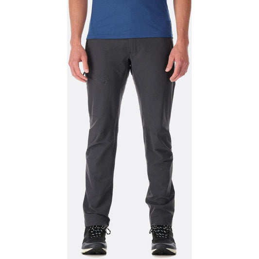 A front view of the Rab Men's Incline Light Pant in Anthracite on a model wearing black shoes against a white background.