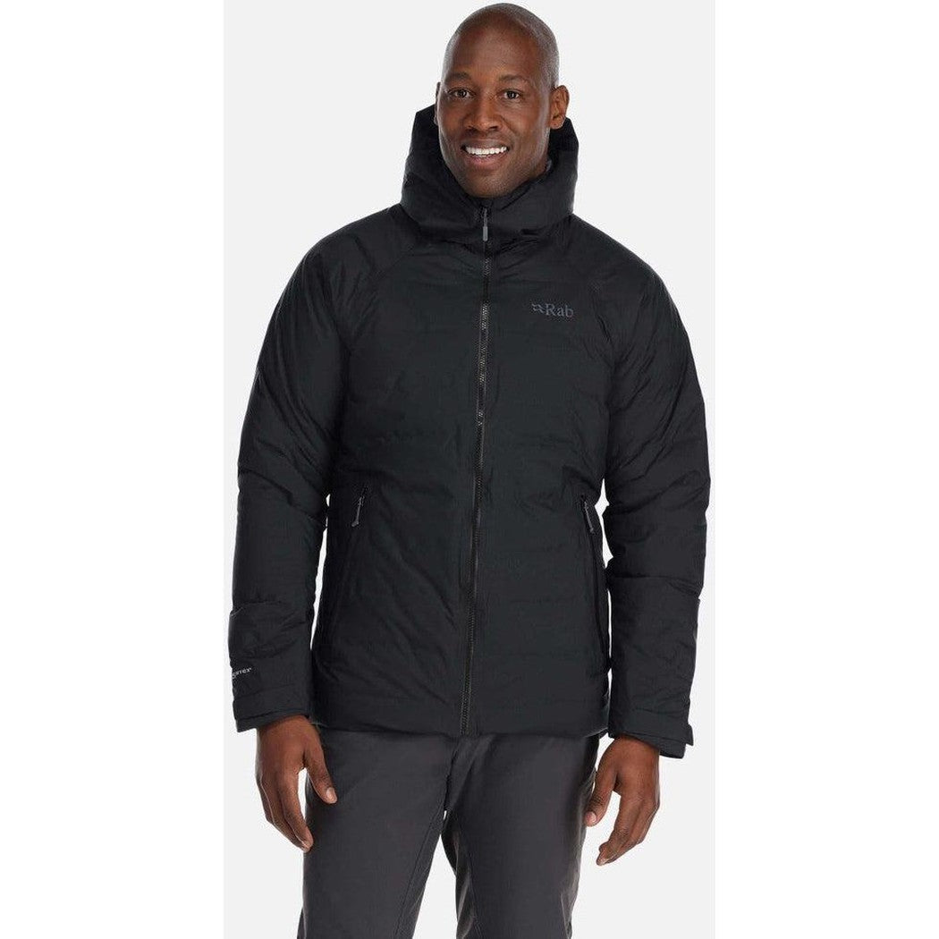 A front view of the Rab Men's Valiance Jacket in Black on a model against a white background.