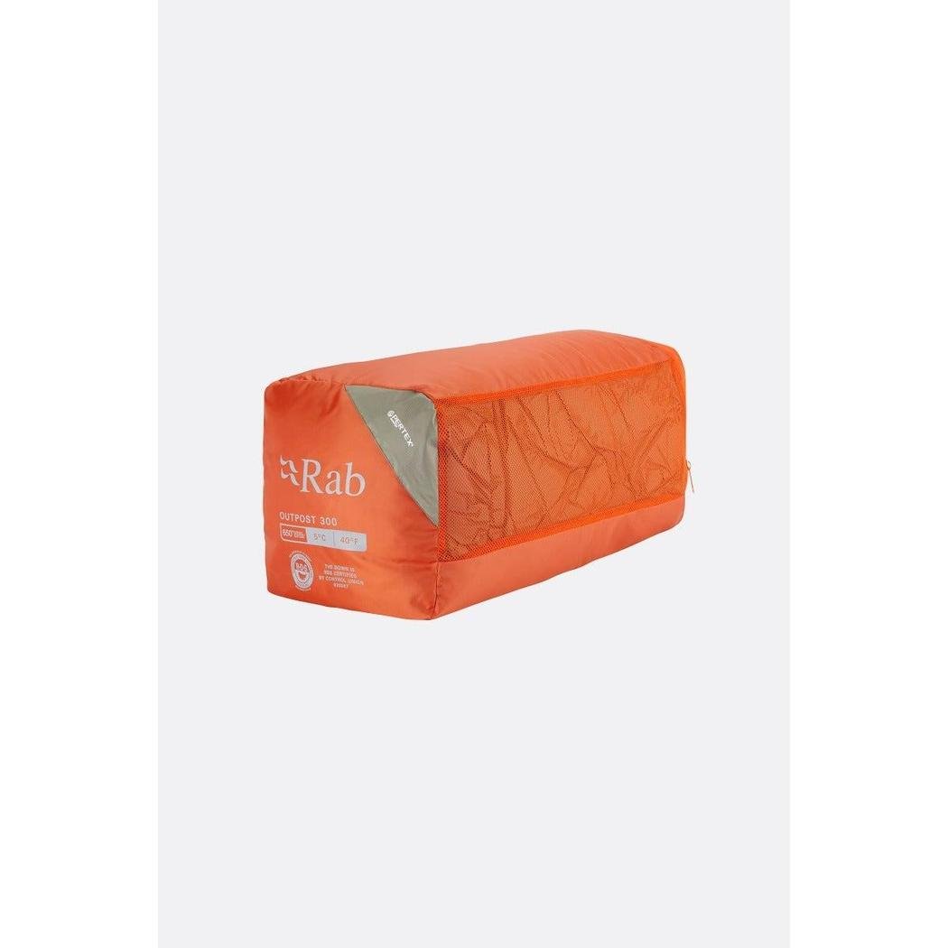 A front view of the orange Rab Outpost 300 REG - Left Zip sleeping bag with a gray label against a white background.