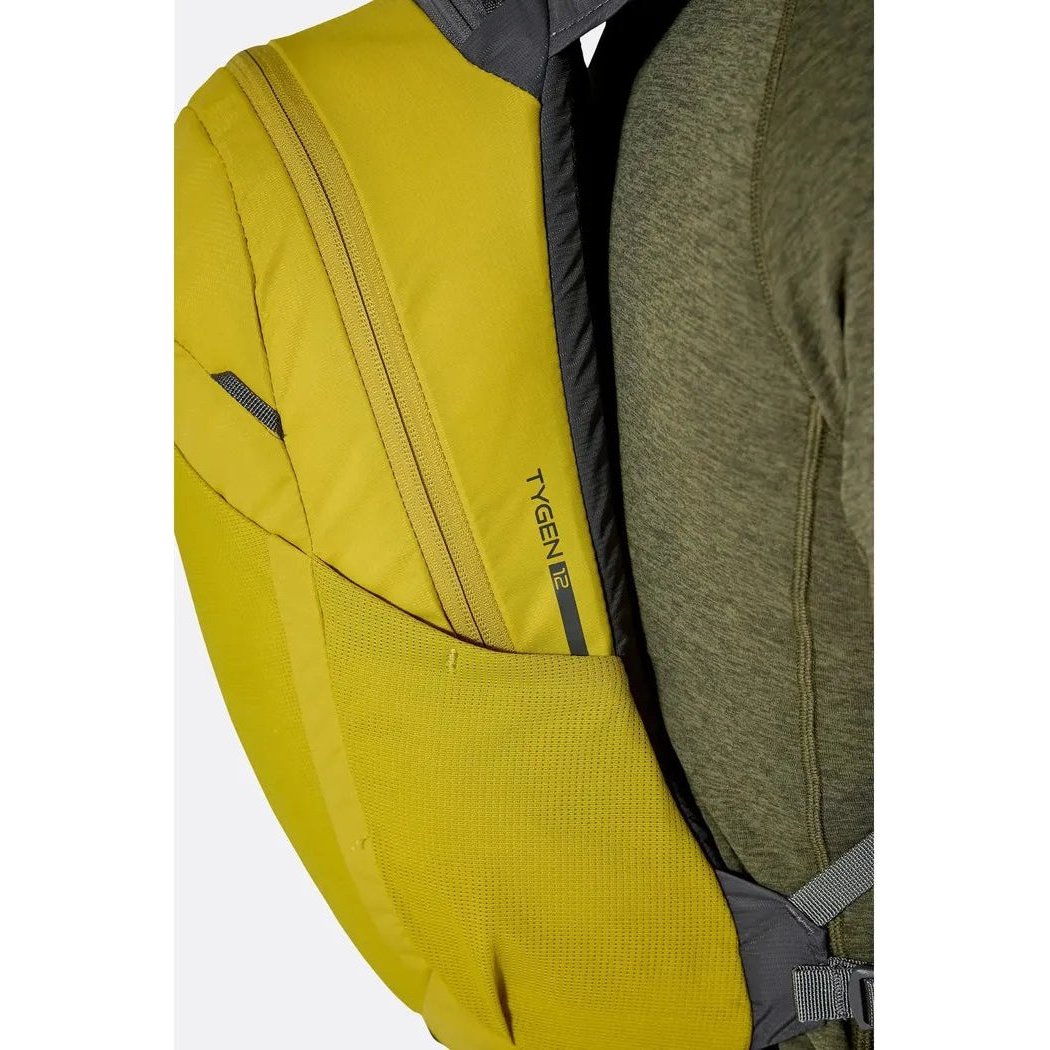 Side view of the Rab Tygen 12 backpack in Black showing the front pocket and shoulder strap against a white background.