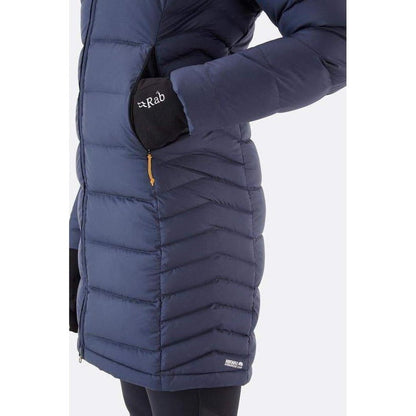 Side view of the Rab Women's Deep Cover Parka in Army showing the front pocket and black glove against a white background.