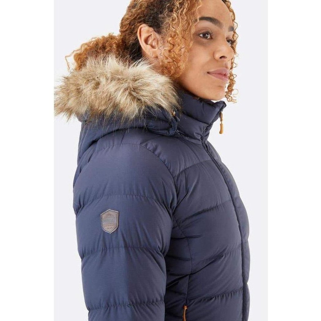 Side view of the Rab Women's Deep Cover Parka in Army showing the fur-lined hood against a white background.