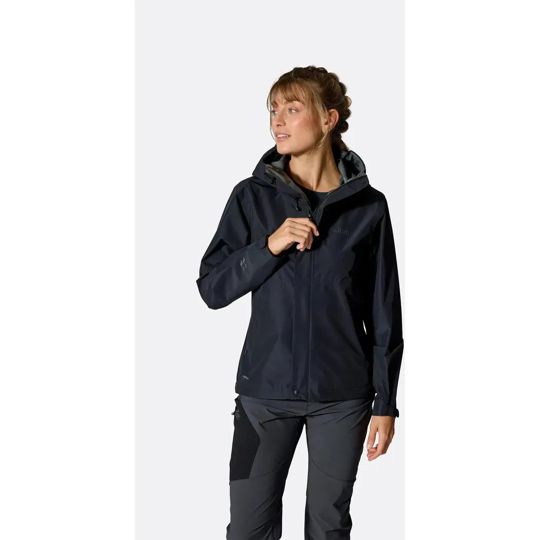 Side view of the Rab Women's Downpour Jacket in Black on a model against a white background.