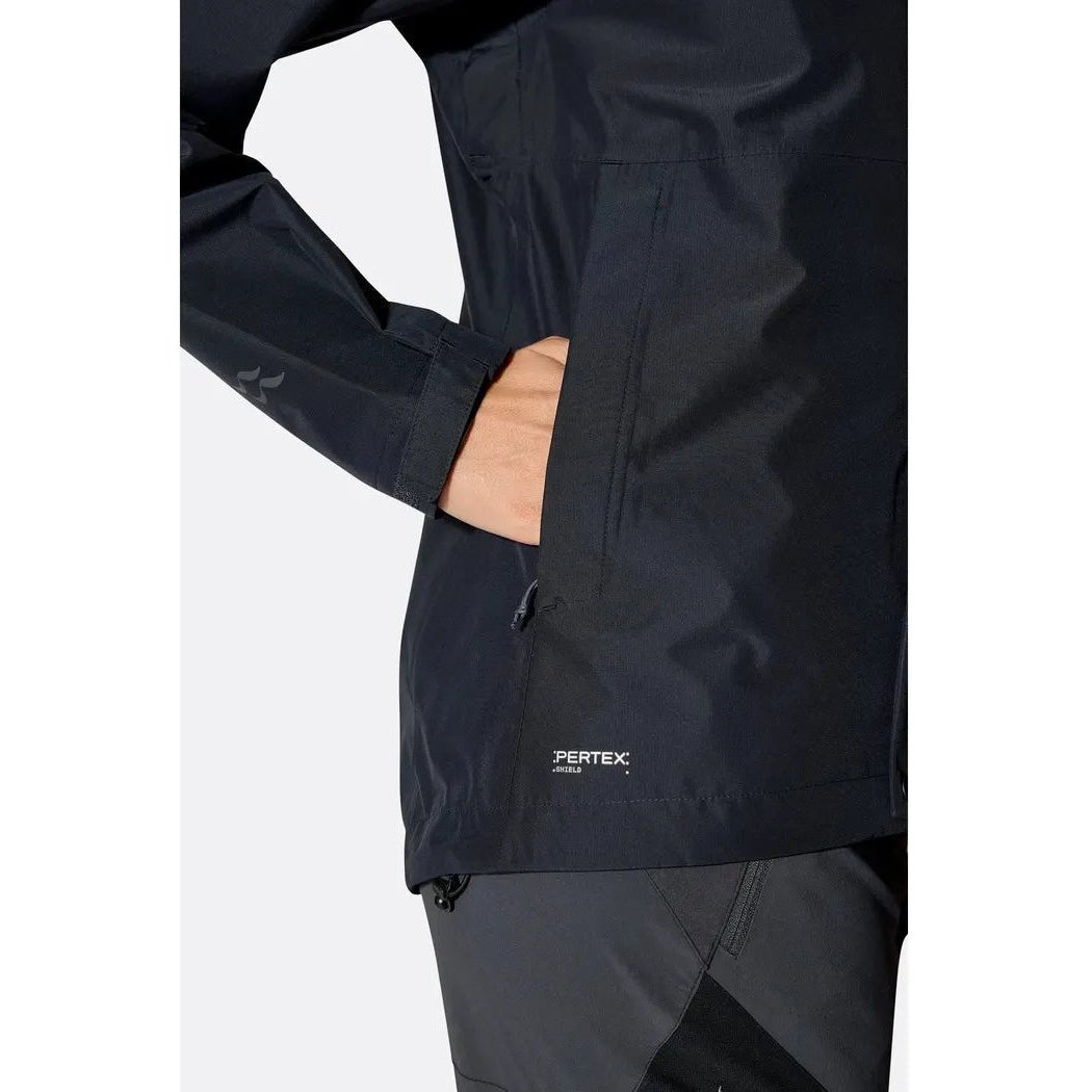 Side view of the Rab Women's Downpour Jacket in Black showing the Pertex logo and a model's hand in the pocket against a white background.