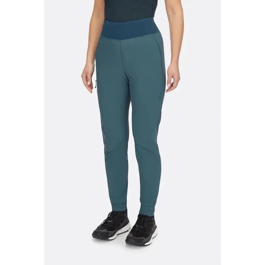 A front view of the Rab Women's Momentum Pants in Beluga color, showing the high waistband and model wearing black sneakers against a plain white background.